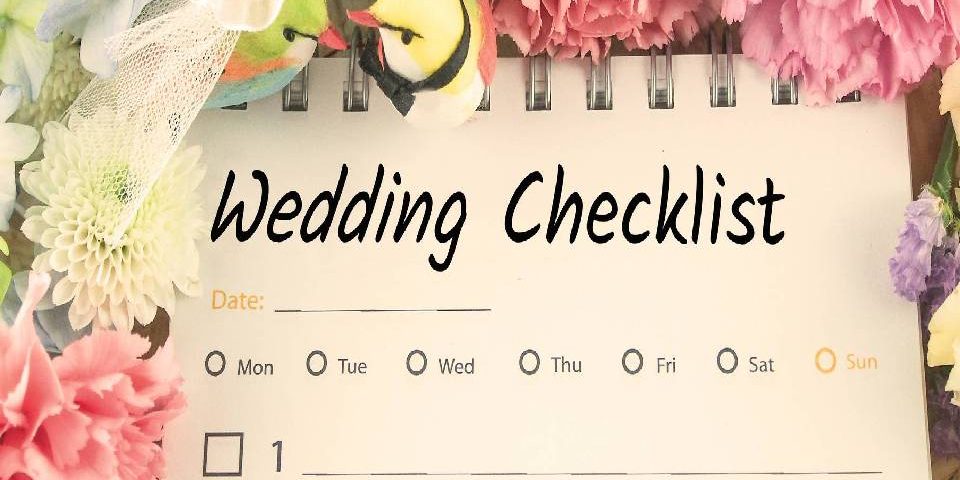 Image that resembles a note of Wedding Checklist that surrounded by a bunch of flowers.