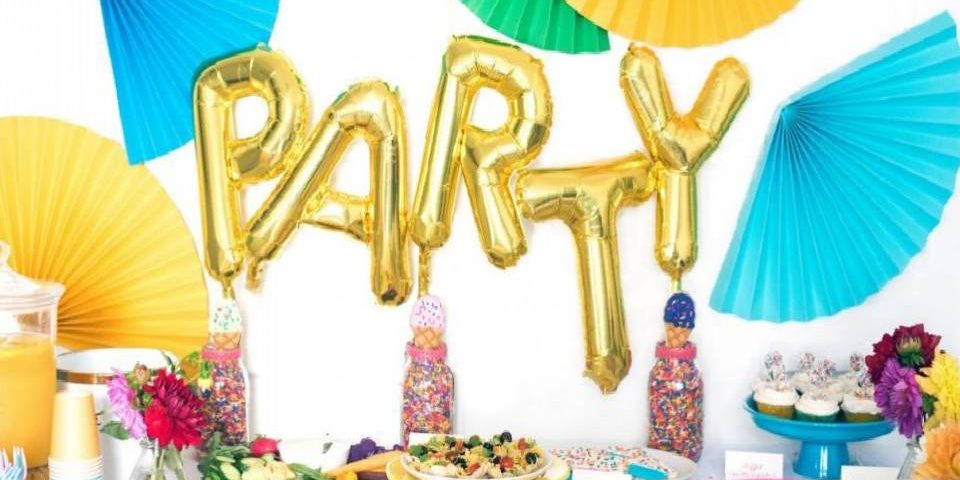 Alphabets of the word Party are put up as decor in golden coloured.