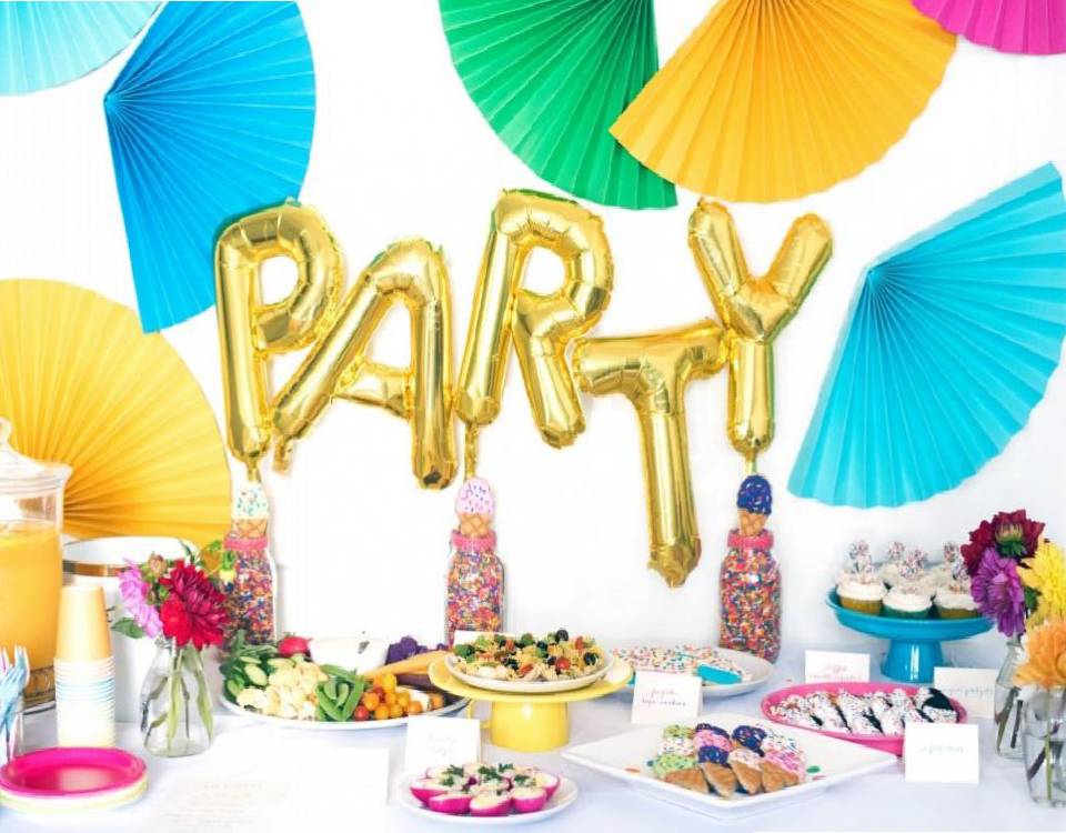 Alphabets of the word Party are put up as decor in golden coloured.