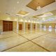 A spacious air conditioned wedding hall with great ambience with golden and white coloured ceiling.