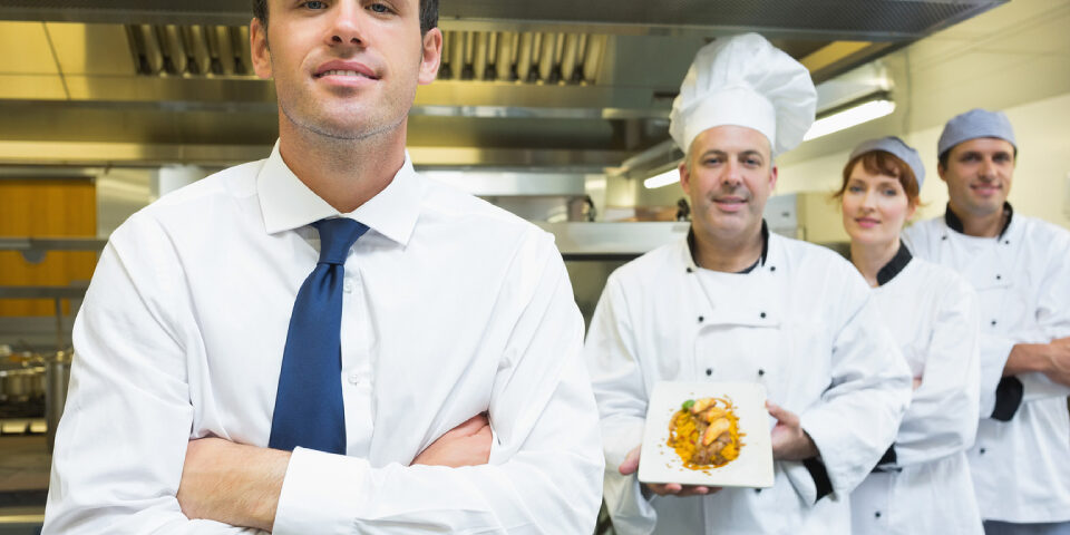 A Restaurant manager with his team.